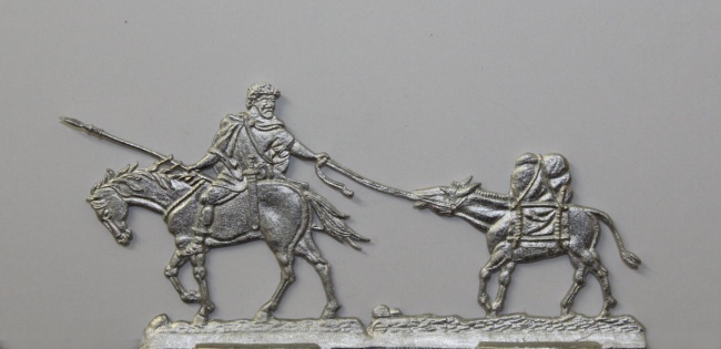 numidischer Reiter ein bepacktes Maultier führend